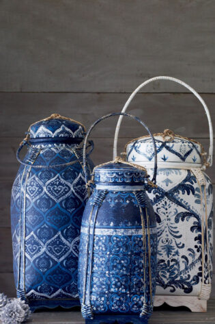 Set of blue and white hand-painted baskets, showcasing intricate patterns and golden accents, blending functionality with artisanal beauty.