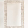 Exquisitely handcrafted carved wood mirror frame with tribal designs in a whitewash finish, ready to complement your nature-inspired home decor.