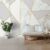 Modern wallpaper featuring a gold stripes marble pattern, adding a luxurious and elegant touch to a minimalist living room setup.