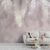 Chic and serene living room accented by Hanging Tropical Leaves wallpaper, with silhouettes of palm fronds creating a calm and elegant botanical atmosphere.