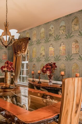 Opulent dining room adorned with Ramayan Jharokha Antique painting wallpaper, depicting scenes from the epic in a jharokha style, enhancing the room's cultural and aesthetic appeal.