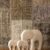 Marble elephant family artefacts by Natural Handicrafts on a textured surface